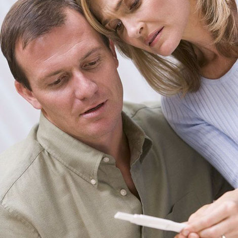 A couple looking at the results of a pregnancy test